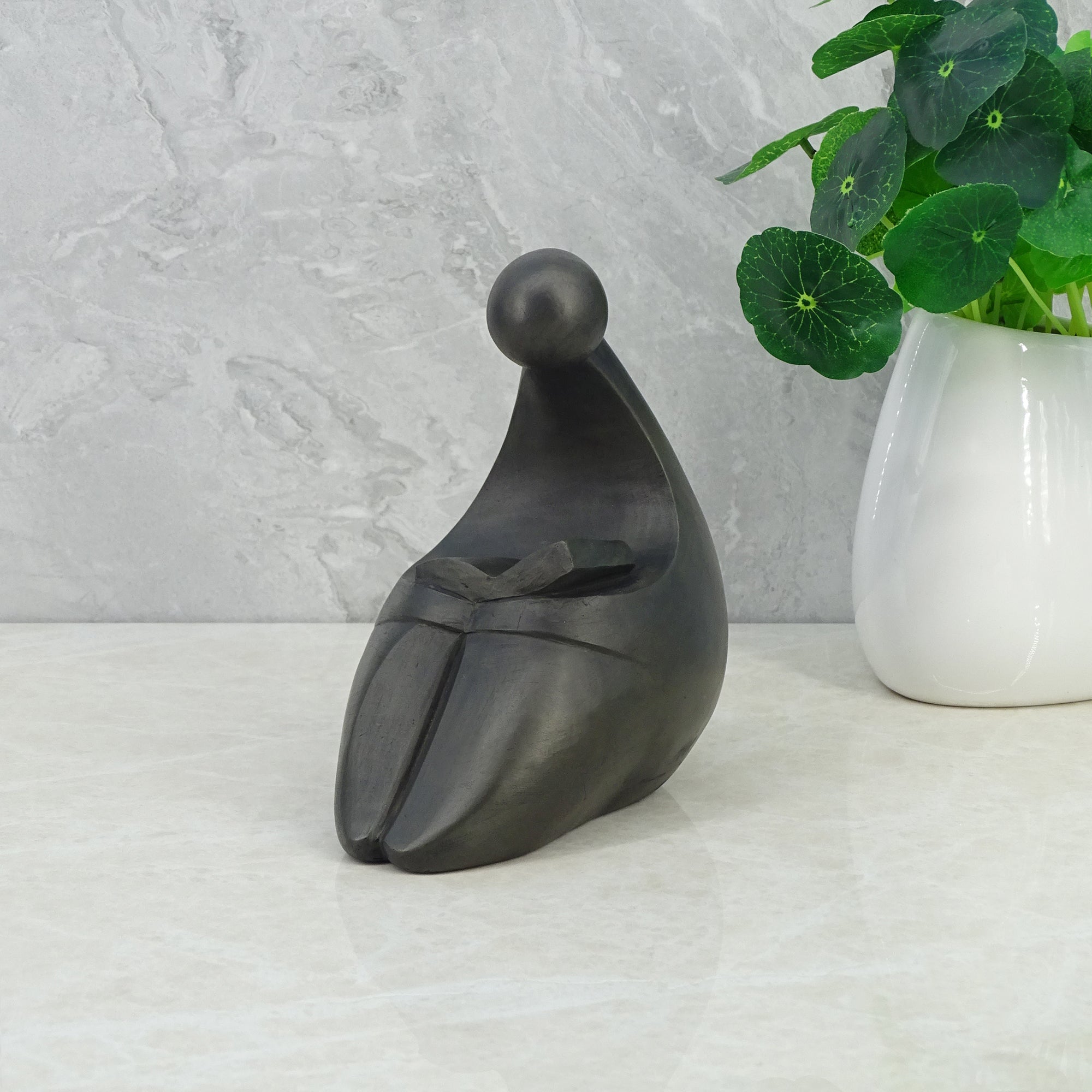 Noire Polyresin Man Reading Book 15 Cm in Black Colour