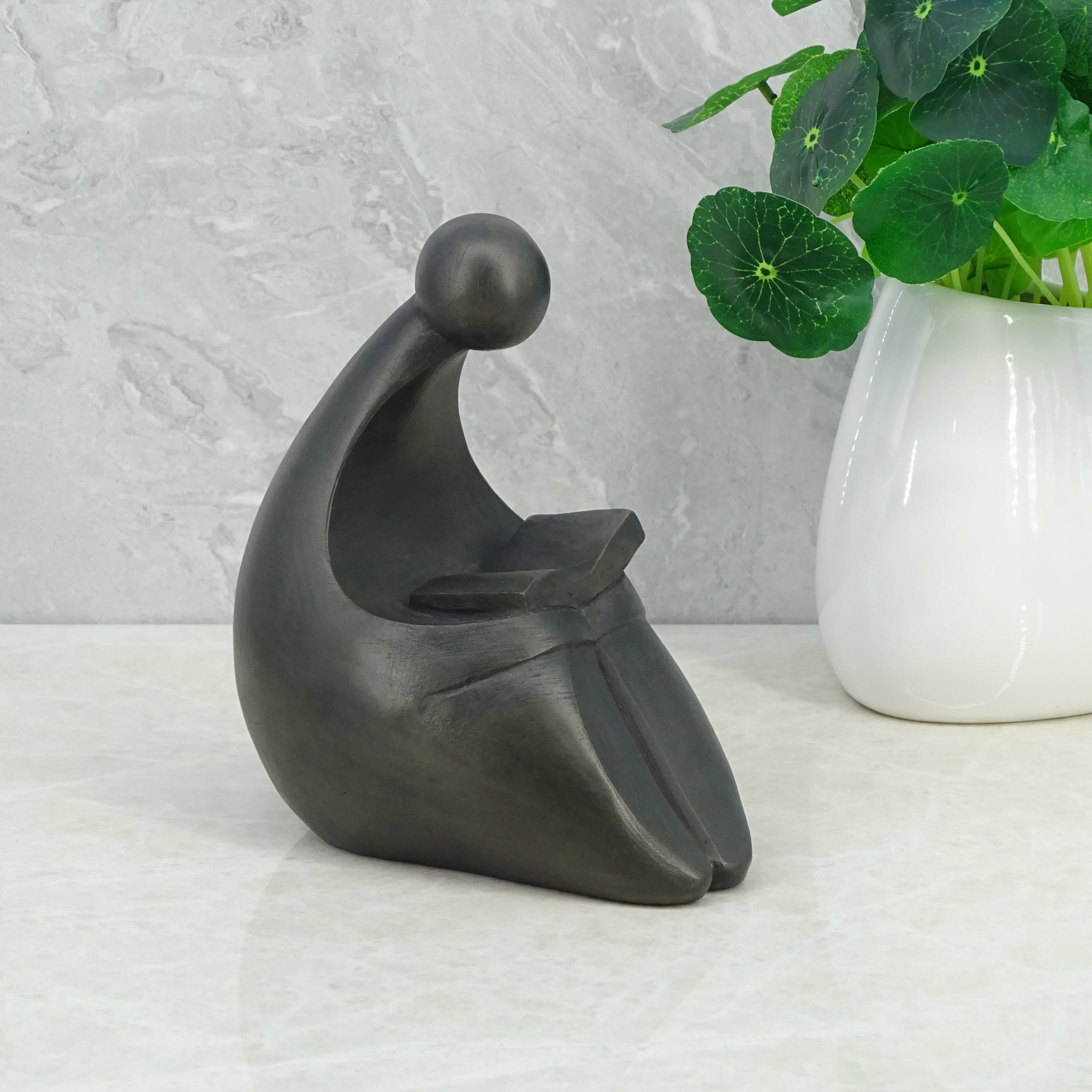 Noire Polyresin Man Reading Book 15 Cm in Black Colour