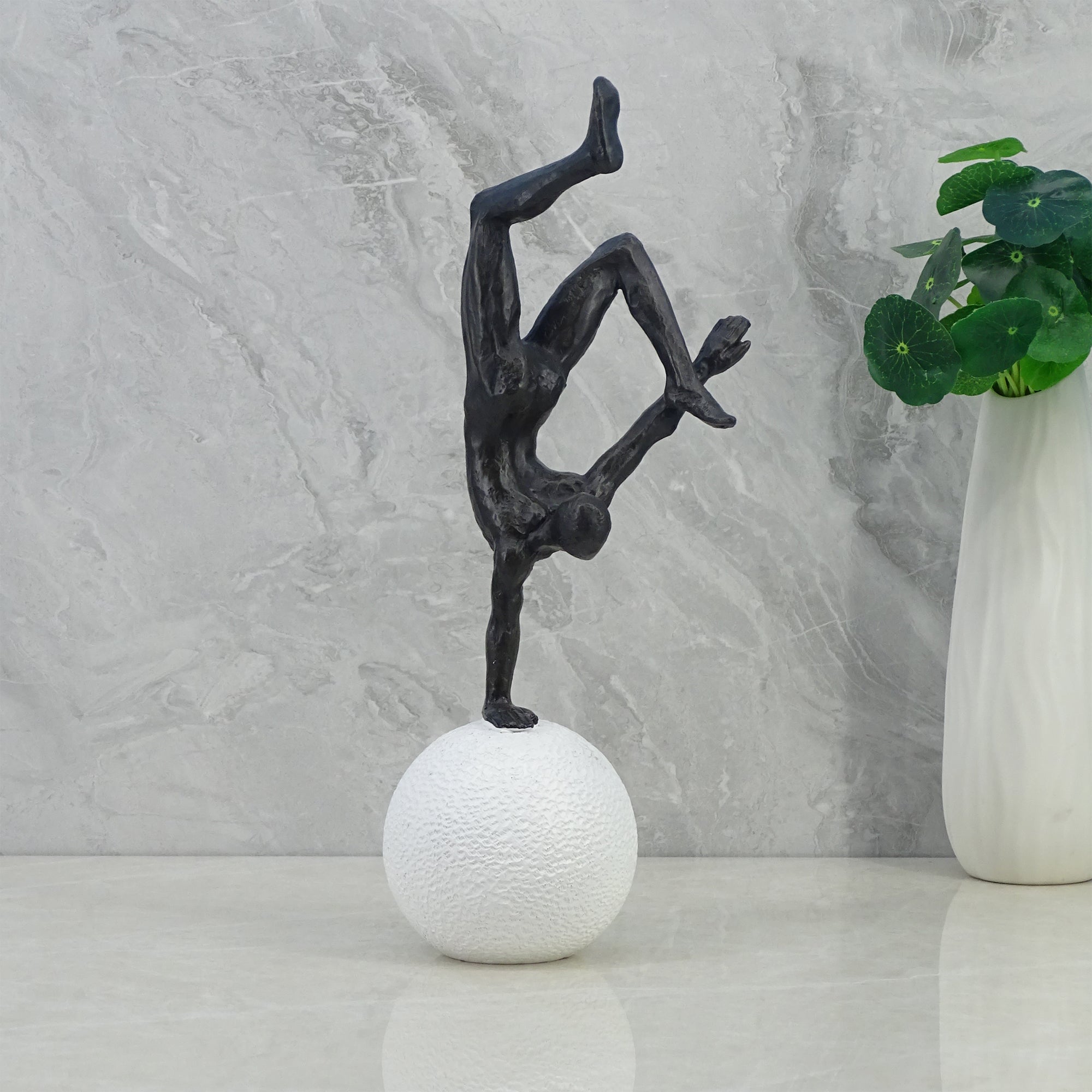 Willow Polyresin Man Balancing On Ball 30Cm in Black And White Colour