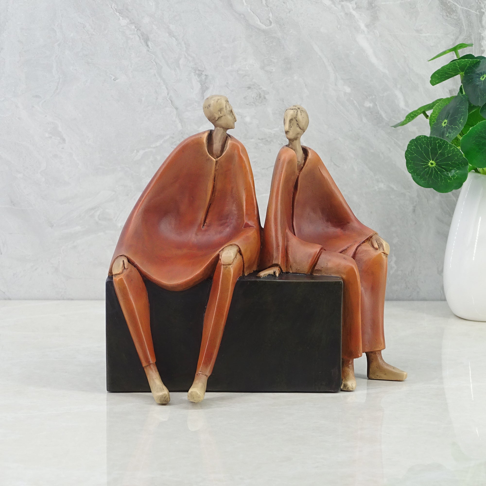 Alpine Polyresin Men Sitting On Bench 18 Cm in Brown Colour