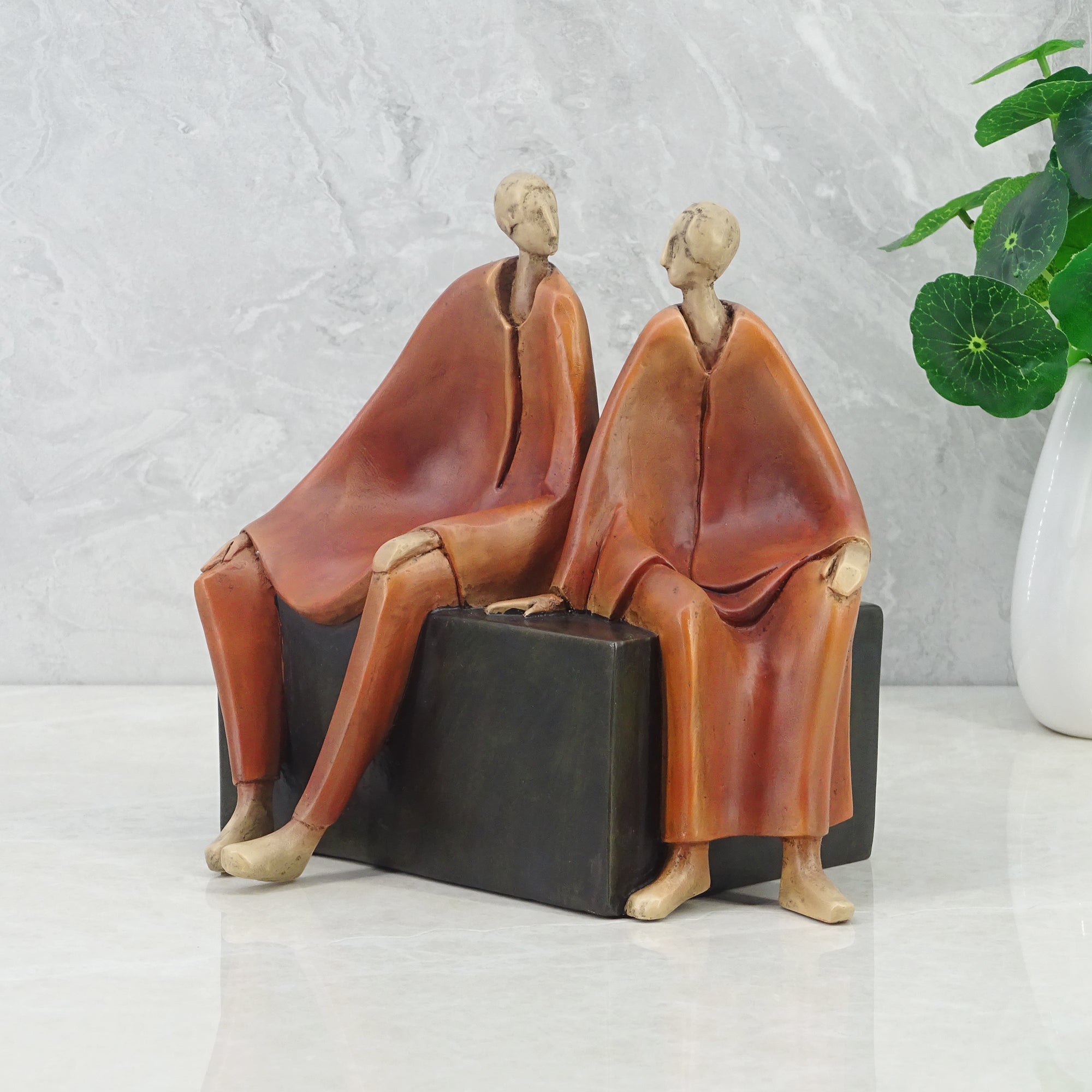 Alpine Polyresin Men Sitting On Bench 18 Cm in Brown Colour