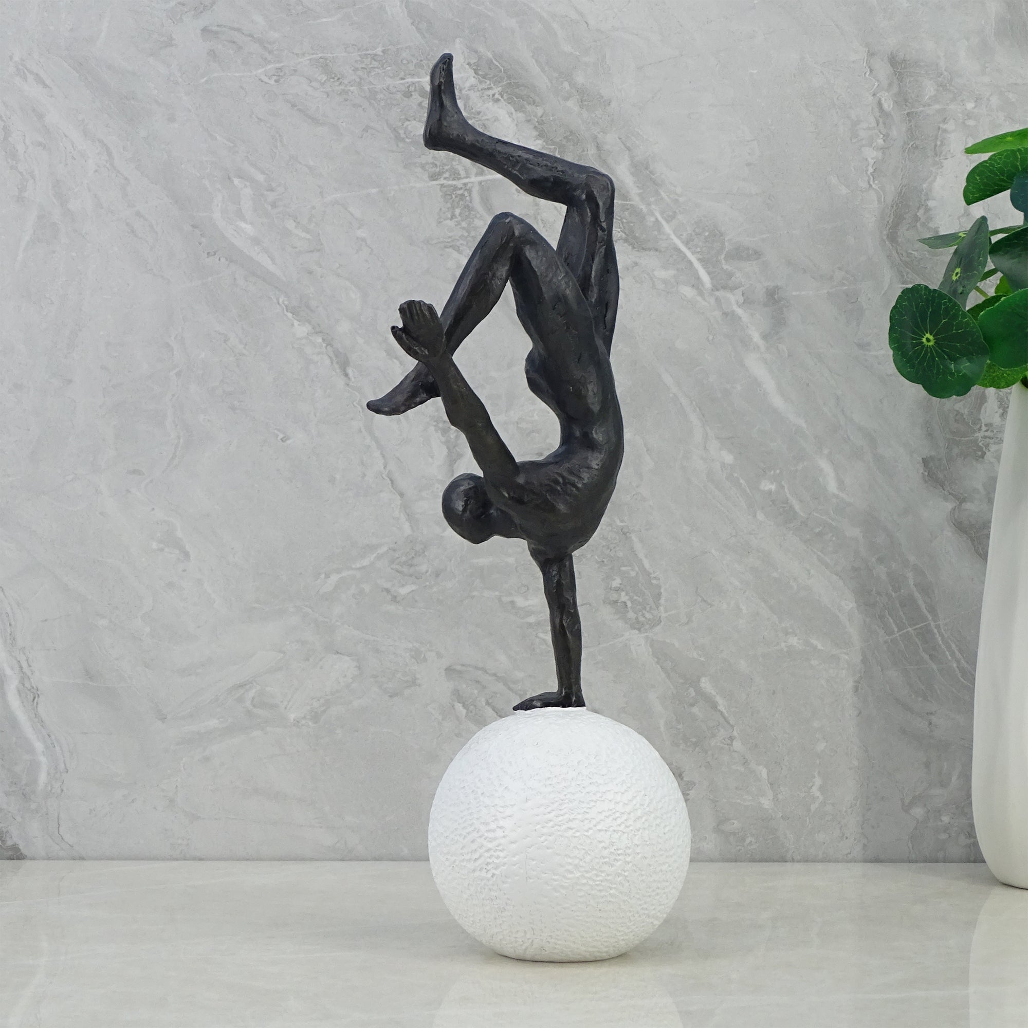 Willow Polyresin Man Balancing On Ball 30Cm in Black And White Colour