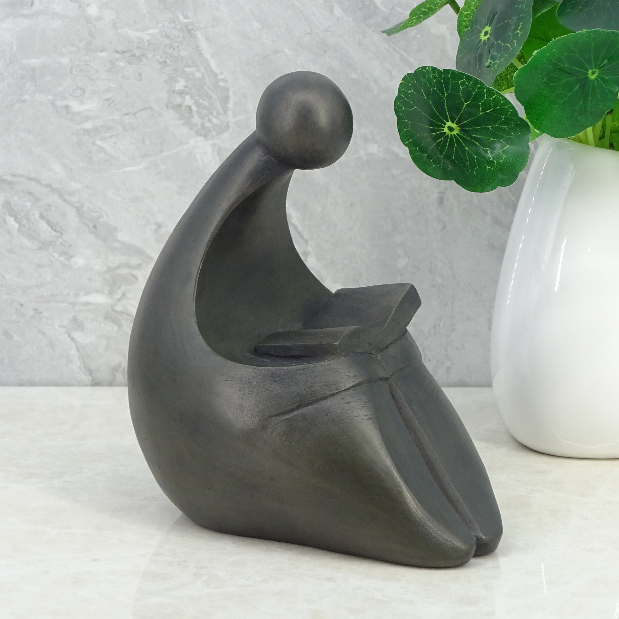 Noire Polyresin Man Reading Book 15 Cm in Black Colour
