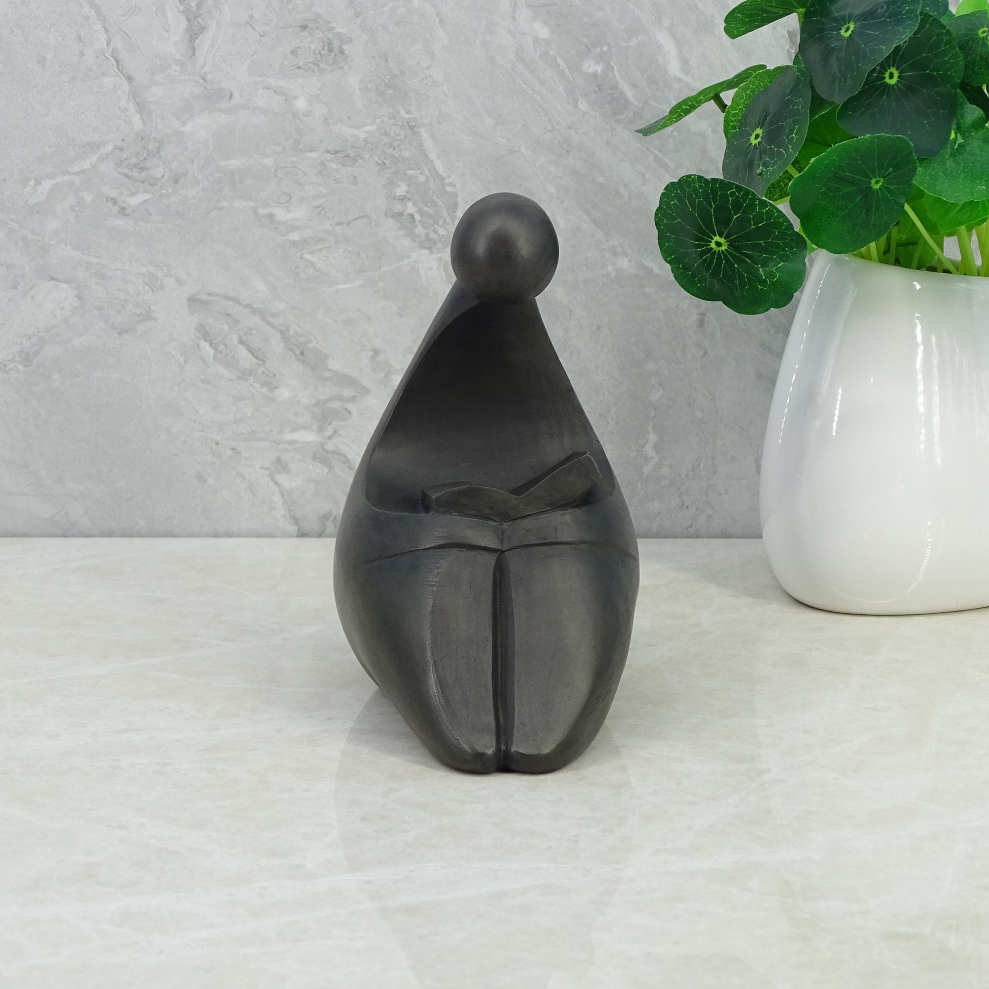 Noire Polyresin Man Reading Book 15 Cm in Black Colour