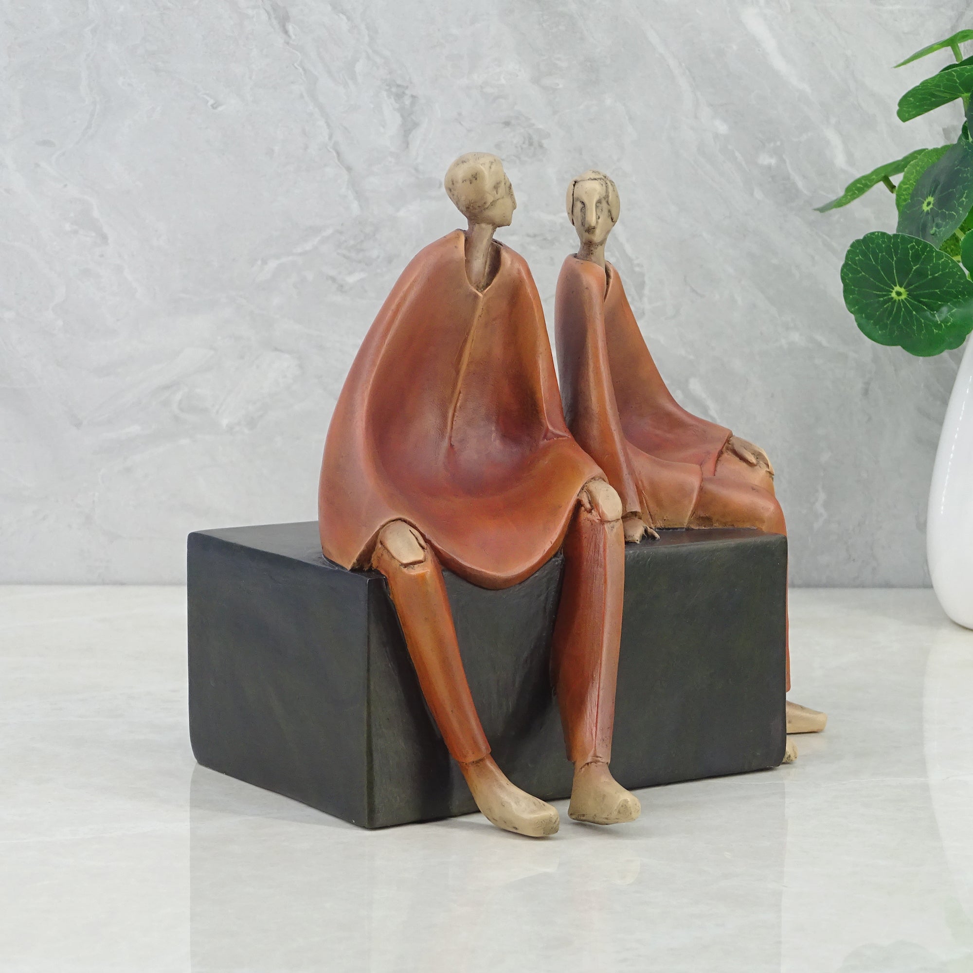 Alpine Polyresin Men Sitting On Bench 18 Cm in Brown Colour